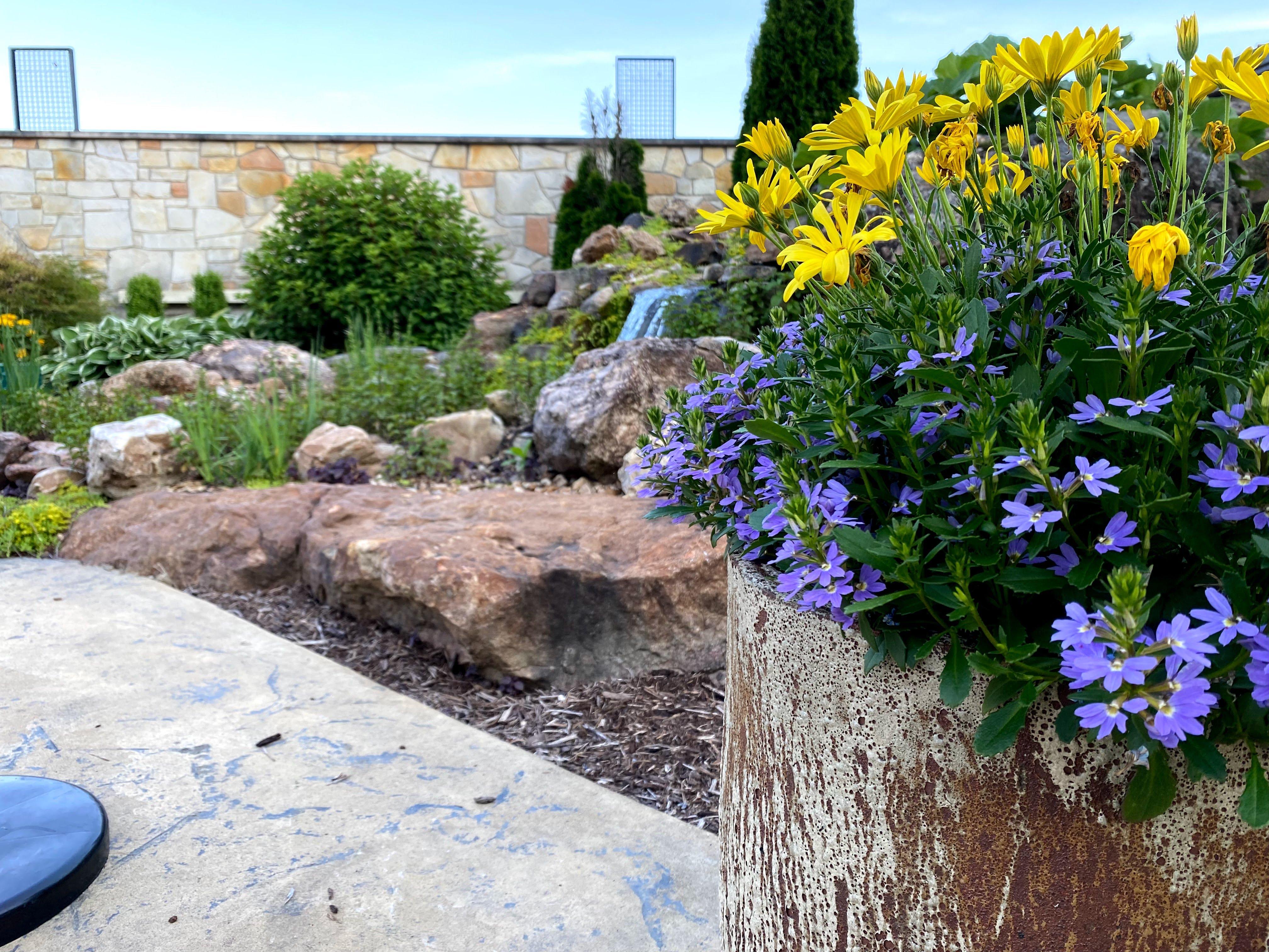 Custom commercial stone wall and waterfall installation at a winery